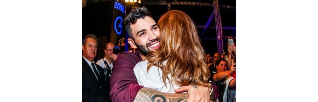 Gusttavo Lima abraçado com fã, Joyce Alvarenga dos Santos