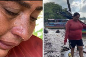 Aurizelia com o filho de 13 anos que ajuda ela com a pesca